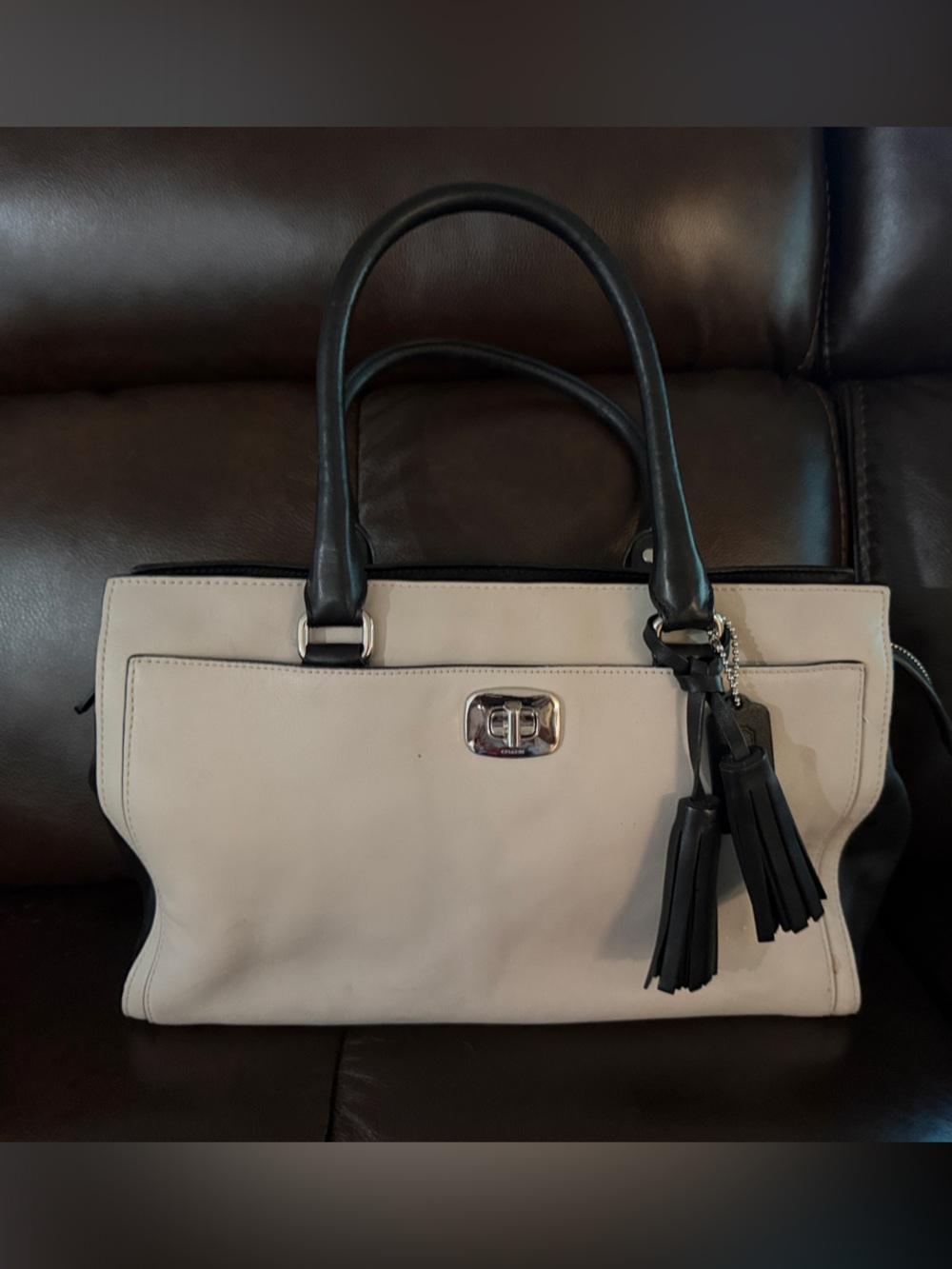 Coach Cream and Black Leather Tote with Tassel Accents